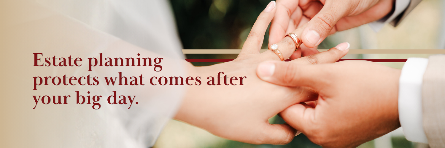 man putting wedding ring on woman's left hand