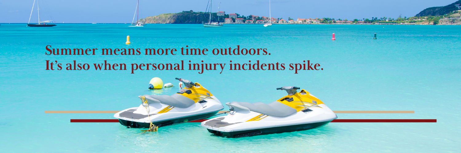 2 unoccupied jet ski parked in a shallow boat harbor with sailboats in the distance